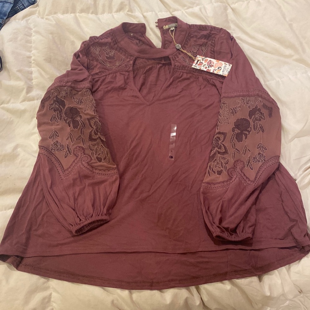 Loose women shirt from buckle with tags. It fits loose and flowing.